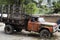 An old, orange truck rests abandoned