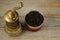 Old oriental pepper mill and black pepper peas