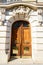 Old ornate door in Paris - typical old apartment buildiing.