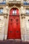 Old ornate door in Paris - typical old apartment buildiing.