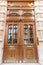 Old ornate door in Paris - typical old apartment buildiing.