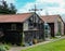 Old outbuildings and shed seen in an English back garden.