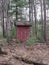 Old Outhouse in the Middle of a Northern Forest