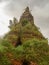 Old overgrown Buddhist stupa, Laos