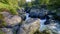 The old packhorse bridge known as Birk`s Bridge across the river Duddon near Seathwaite in the Lake District National Park