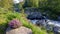 The old packhorse bridge known as Birk`s Bridge across the river Duddon near Seathwaite in the Lake District National Park