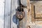 Old padlock on a wooden door. Heavy granary iron lock