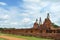 Old pagoda and ruined Buddha statue in Chaiwatthanaram temple.