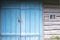 Old painted blue wooden door to the old barn. Blue wooden door w