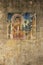 Old painted print of buddha on decayed wall in asia