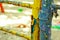 Old painted stairs in the playground close-up on a blurred background. peeling blue and yellow paint. many layers of paint on a