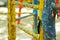 Old painted stairs in the playground close-up on a blurred background. peeling blue and yellow paint. many layers of paint on a