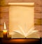 Old paper, candle and open book on wood background