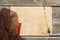 Old paper, fishing net and fishing float, hooks on a wooden table