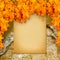 Old paper listing on old brick wall with bright orange leaves