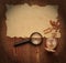 Old paper with pocket watch and magnifying glass