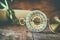 Old parchment and antique compass on wooden table