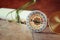 Old parchment and antique compass on wooden table