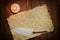 Old parchment paper with a quill and candle, Medieval theme with