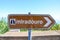 Old, partly damaged brown tourist sign saying miradouro in Portuguese. Information signs. Marking system. Arrow with a symbol of