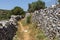 Old path and ancient wall at Melanes traditional village in Naxos. Greece.