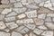 Old pavement made of marble pieces with latin letters