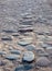 An old paving roadway. Road paved with cobblestones.