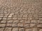 Old paving stones in perspective closeup, background, texture.