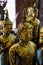 Old peaceful standing buddha image statue covered by gold leaf, Asokaram temple