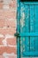 Old peeling green wooden door