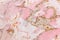 Old peeling weathered outdated paint pink abstract pattern wall texture background