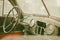 Old photo of Old timer car interior with dusty board and spider web all over the dashboard with rusty levers sepia