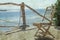 Old photo Stylishly beautiful chair on the sea nature landscape background