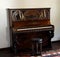 Old piano in music room in Bran castle, Romania