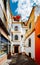 Old picturesque passageway in the medieval Jewish Quarter of Santa Cruz in Seville, Andalusia, Spain