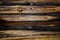 Old pine horizontal boards. The wood texture is brown-yellow with rings and traces of knots.