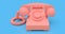 Old pink dial telephone on a blue background. 3d illustration