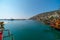 Old pirate ship on the water of Mediteranean sea. Tourist entertainment, coastal tour. Summer sunny day. Mountain shore of Alanya