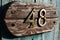 Old plank with number 48 on gate