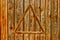 Old planks fenece of natural wooden color with triangle background