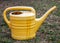 Old plastic yellow flower watering can