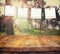 Old polaroid photo frames hanging on a rope with vintage wooden board table in front of abstract forest landscape