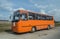 Old Polish school bus orange Autosan front and left side view parked