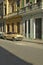 Old Pontiac car parked in front of old buildings in Old Havana, Cuba