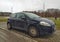 Old popular black cheap city compact car Fiat Punto parked