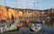 The old port of Bastia Corsica France with St. John the Baptist historic church and shops restaurants cafes and yachts boats