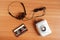 Old portable cassette tape player and headphones on wooden