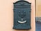old postbox on wall of urban house in Lecco