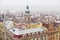 Old Prague architecture and red roofs view from above in winter snowfall