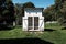 Old primitive white public outhouse in the countryside